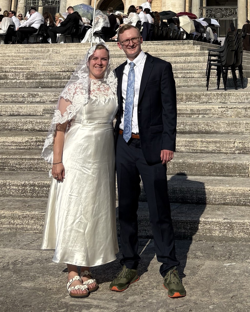 Bride and groom in custom dress at St. Peter's Basilica in Rome