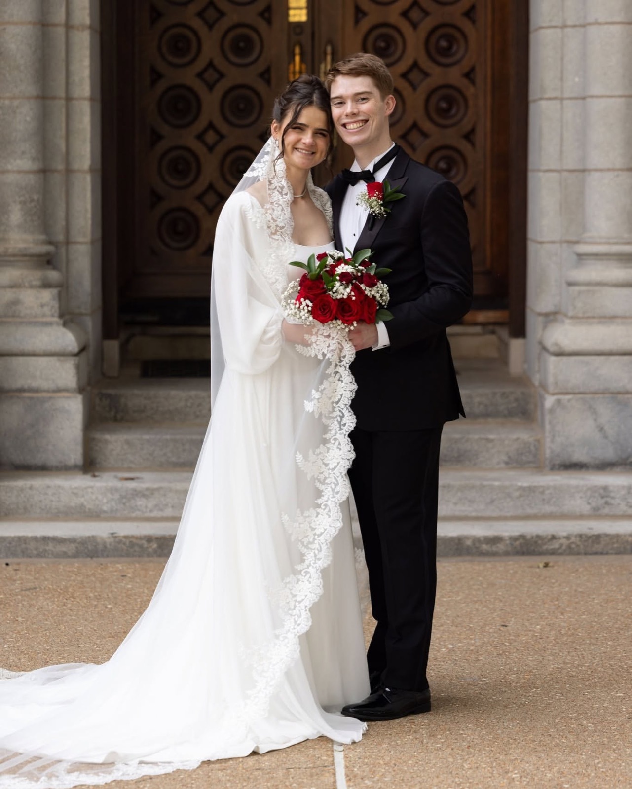 Rebekah in her wedding gown with custom lace veil